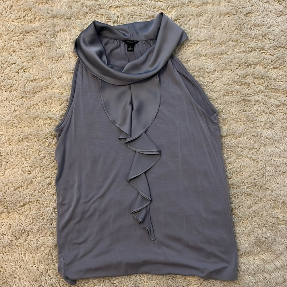 Ice blue sleeveless top with front ruffle detail from Ann Taylor. Size S.